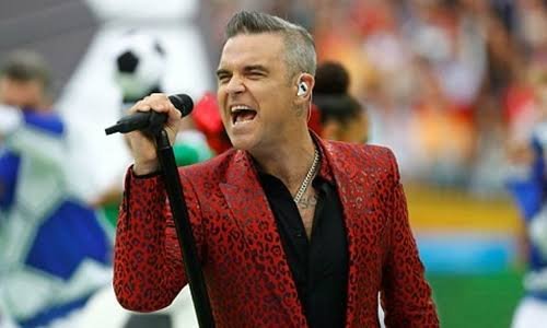 Robbie Williams responde a rumores de consumo de drogas tras un video viral donde aparece un objeto blanco.